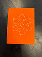Carmen’s orange daisy notebook. Small