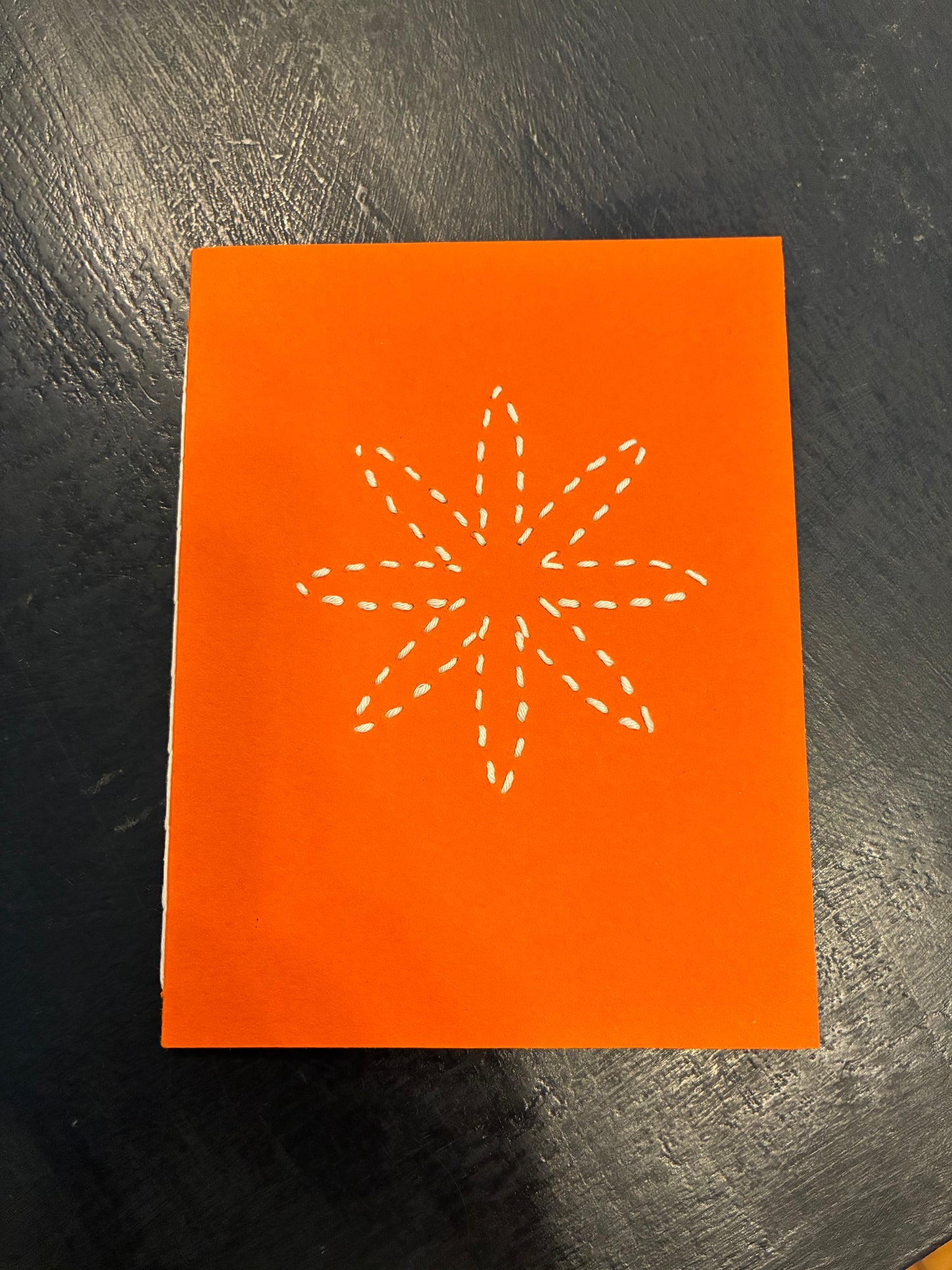 Carmen’s orange star notebook. Small