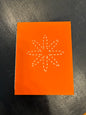 Carmen’s orange star notebook. Small